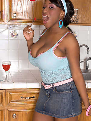 Thick ebony Janet Jade in the kitchen smearing her massive big tits with food