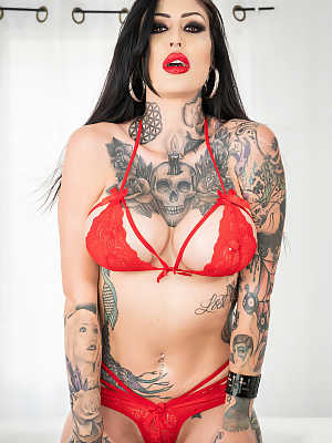 Tattooed American Janey Doe removes her red undies and bra and poses naked