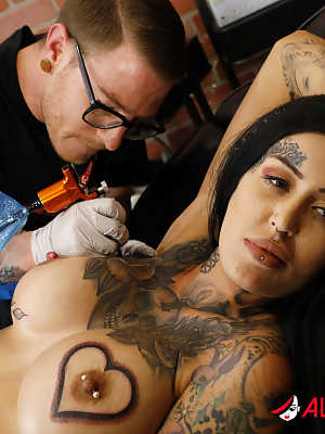 Busty brunette Janey Doe does a hardcore DP after getting a new tattoo