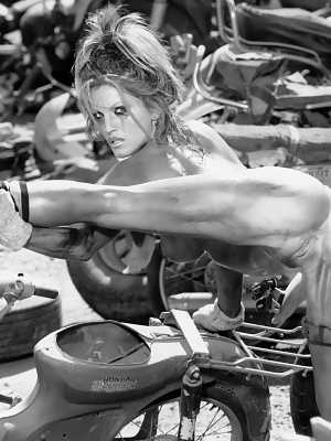 Busty Janine Lindemulder enjoys hot water play in kinky black & white action