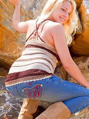 Blonde first timer with a devilish smile exposes her big boobs in bluejeans