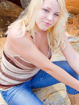 Blonde first timer with a devilish smile exposes her big boobs in bluejeans