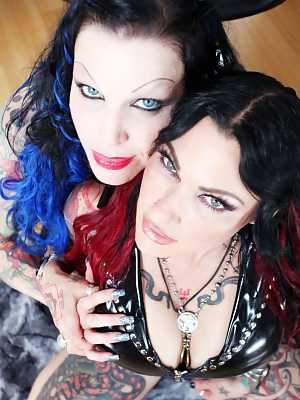 Inked brunettes Vinyl Vixon & Jenevieve Hexxx fondle each other while clothed