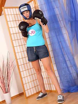 Boxing girl Hika shows natural tits and takes blue dildo to satisfy pussy