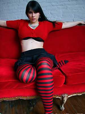 Goth girl Jennique looses her big breasts from a bra in striped OTK socks