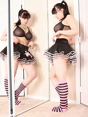 Busty amateur Susy Rocks models non nude afore mirror in skirt and socks