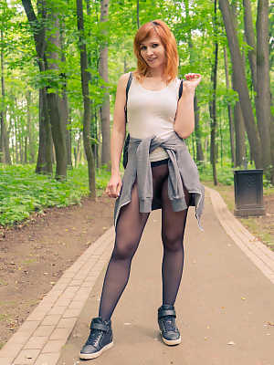 Amateur ginger Jeny Smith	posing in her sheer pantyhose in public