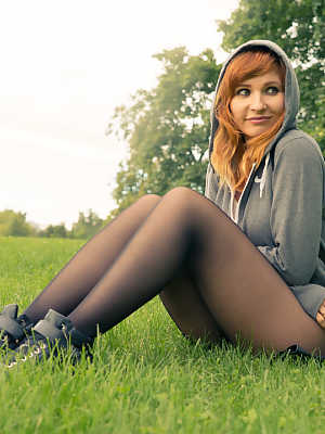 Amateur ginger Jeny Smith	posing in her sheer pantyhose in public