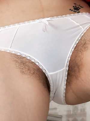 Solo girl Jessi Green releases her hairy bush from white underwear