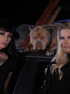 Horny babes Jessica Drake and Jessie Lee strip and play on a car