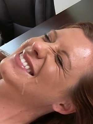 Jessica Heart receives a cumshot on her smiley face after a great blowjob