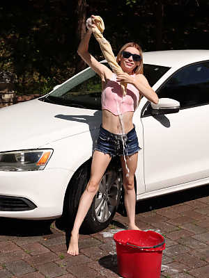 Slim teen Jessica Marie gets completely naked while washing a car in a drive