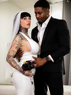 Tattooed bride Jessie Lee deepthroats her black groom prior to anal sex