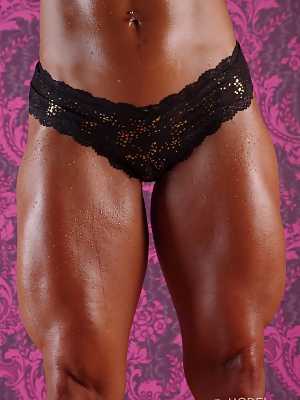 Blonde MILF bodybuilder Jill Rudison showing her strong oiled body in lingerie