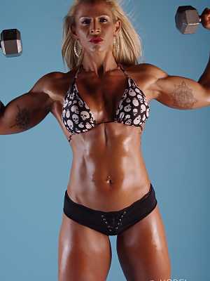 Blonde MILF bodybuilder Jill Rudison flaunts her oiled body while working out