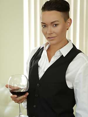 Androgynous short haired model Jiz Lee posing in her male outfit