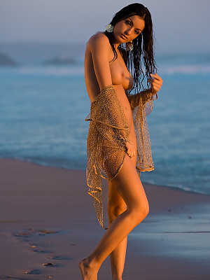 Stunning Latina Jo Garcia pulls out her big tits and poses on the beach