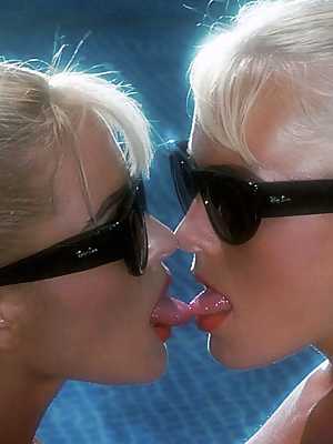 Blonde look-alike babes Joanne Guest & Lena Johansson kiss & fondle poolside