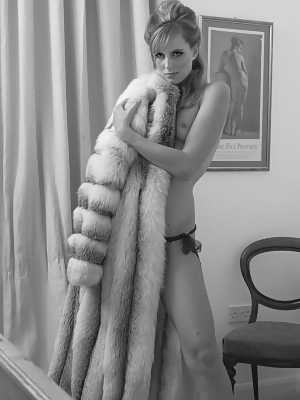 UK model Joceline Brook Hamilton removes a full-length fur coat to get naked