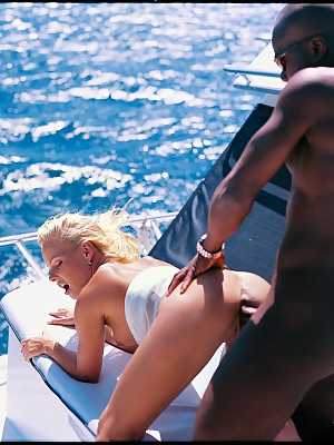 Blonde with big boobs Jodie Moore enjoys outdoor interracial sex on a yacht