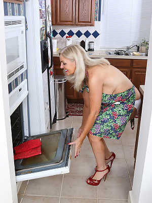 Horny mature housewife Judy Mayflower masturbates with kitchen implements