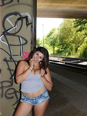 Hot German fatty July Johnson teases with a big tits & sexy ass by the railway